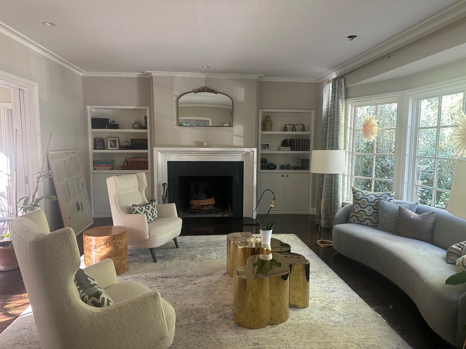 A living room before painting, with beige walls and ceiling